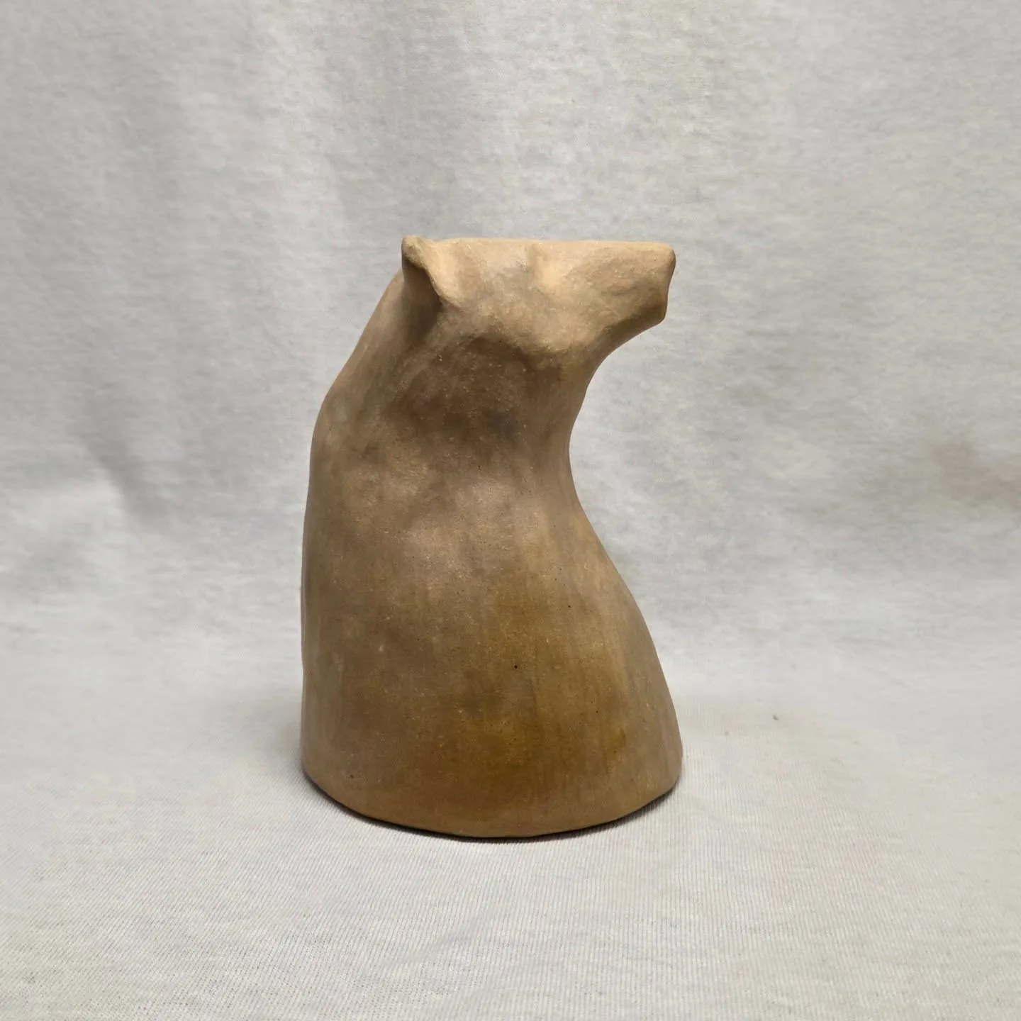 Unglazed stoneware cup formed as a bear.